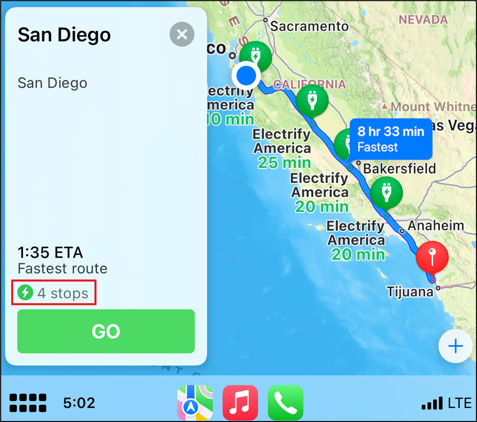 Apple CarPlay Maps with eight hour route and four electric vehicle charge stations identified along the way